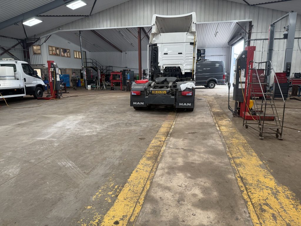 HGV workshop floor before refurbishment at the MAN UK dealership