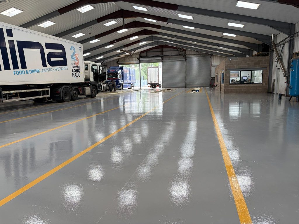Finished Mid Grey Pumatect floor with Safety Yellow lines in the HGV workshop