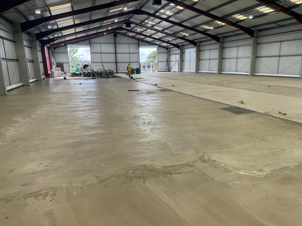 Polymer screed establishing the falls across the production area