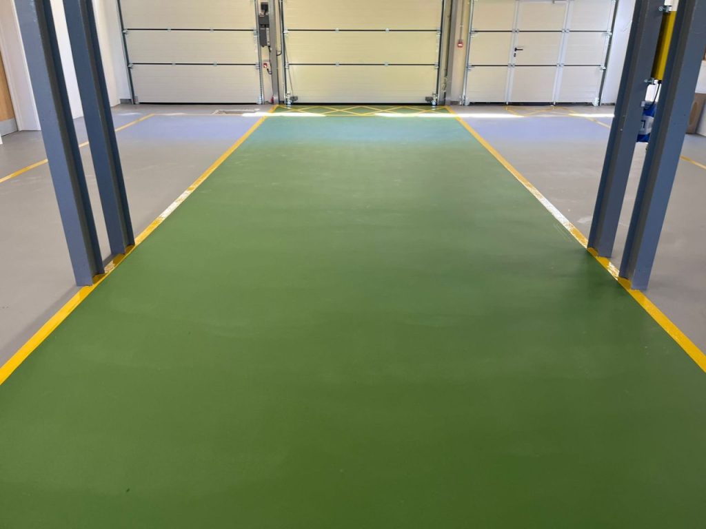 Green vehicle bay with Safety Yellow lines on Pumadur RT floor