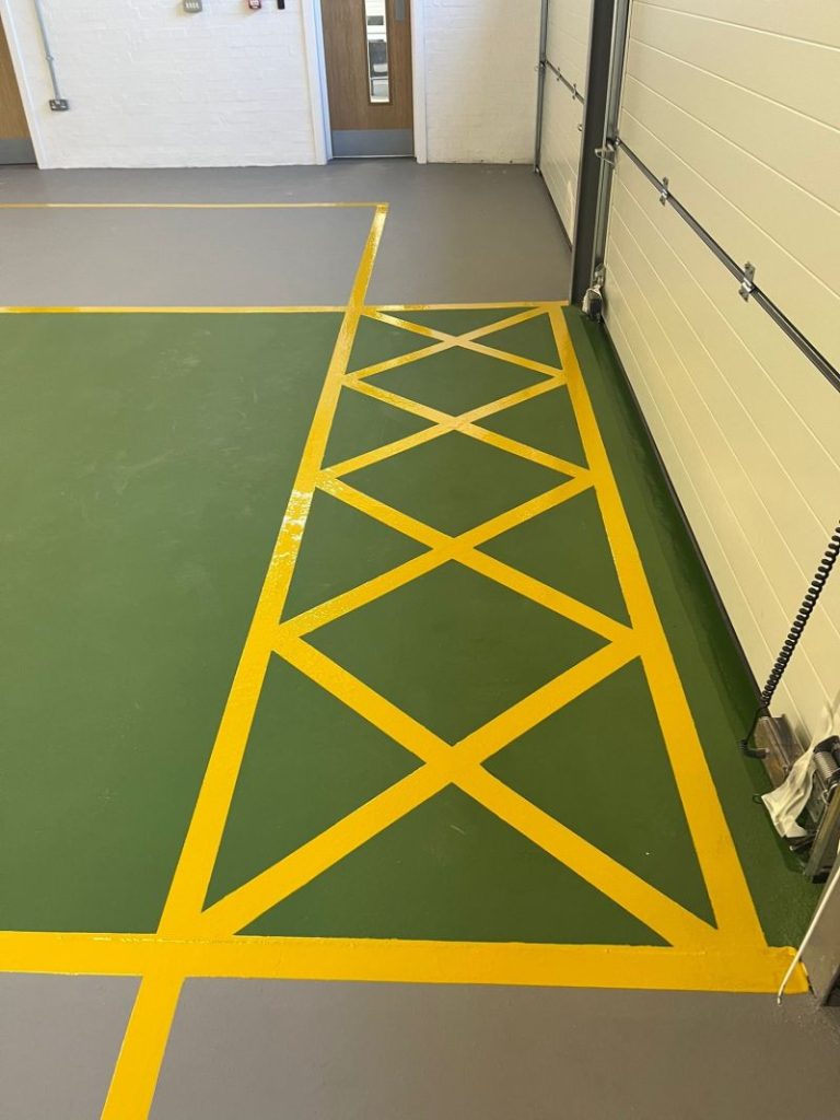 Safety Yellow entrance hatching on green Pumadur RT floor