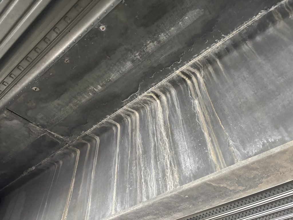 Water ingress staining on the car park soffit below the deck