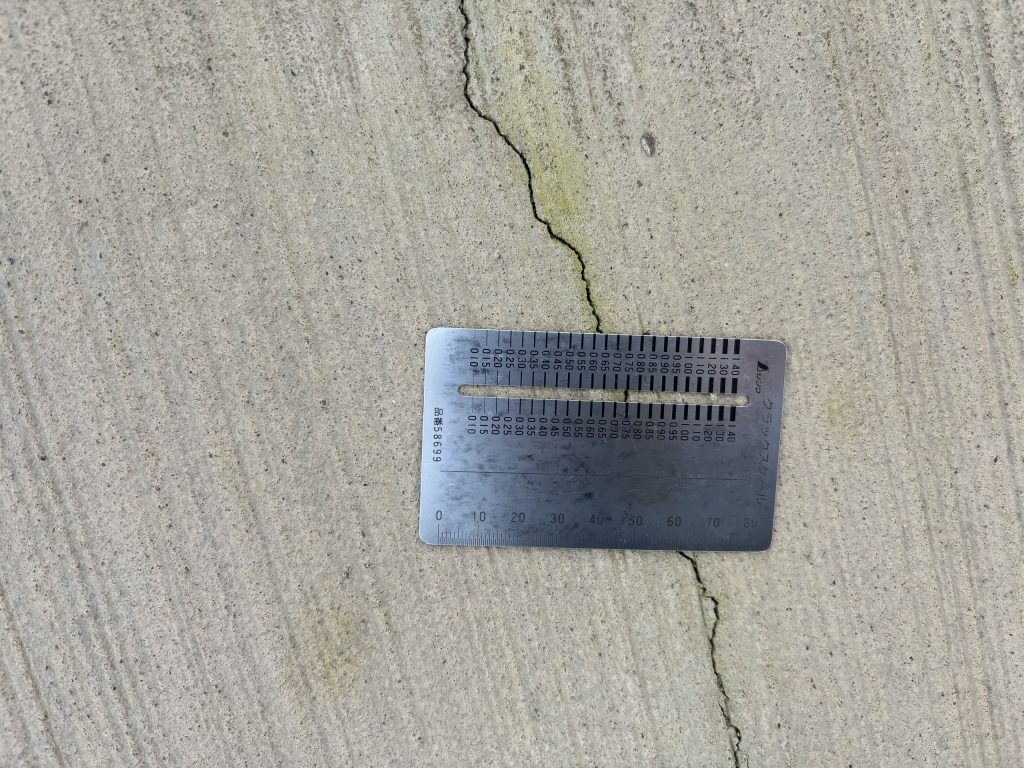 Measuring a crack in the original concrete deck