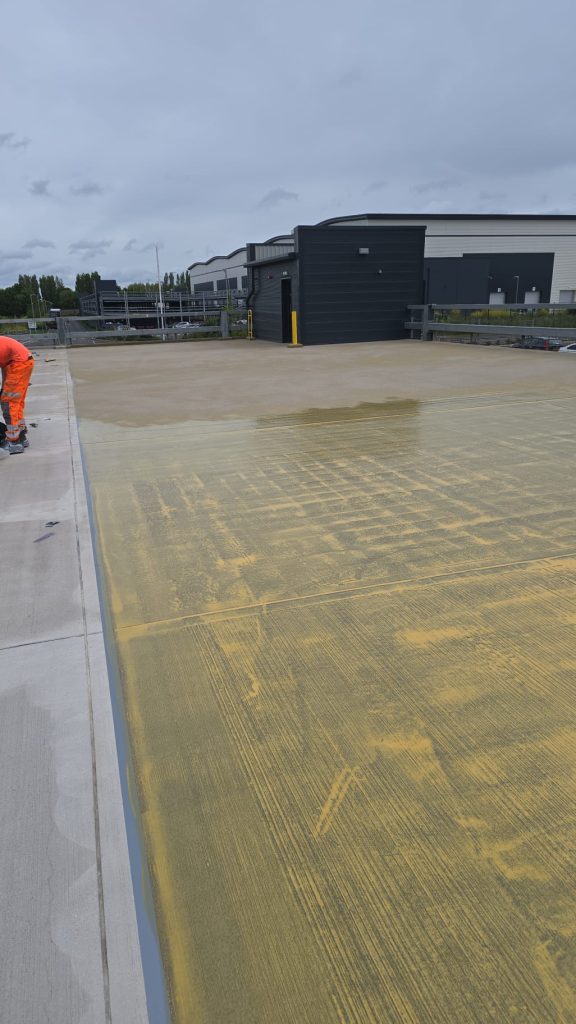 Waterproofing membrane being applied to the car park deck